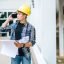 architects-hold-floor-plans-and-talk-on-the-phone-1-1.jpg